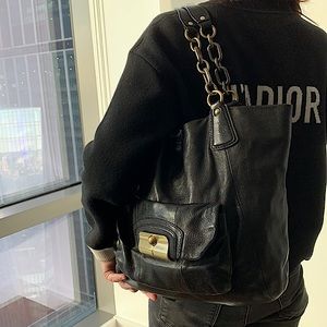 Vintage Coach medium sized black leather tote.